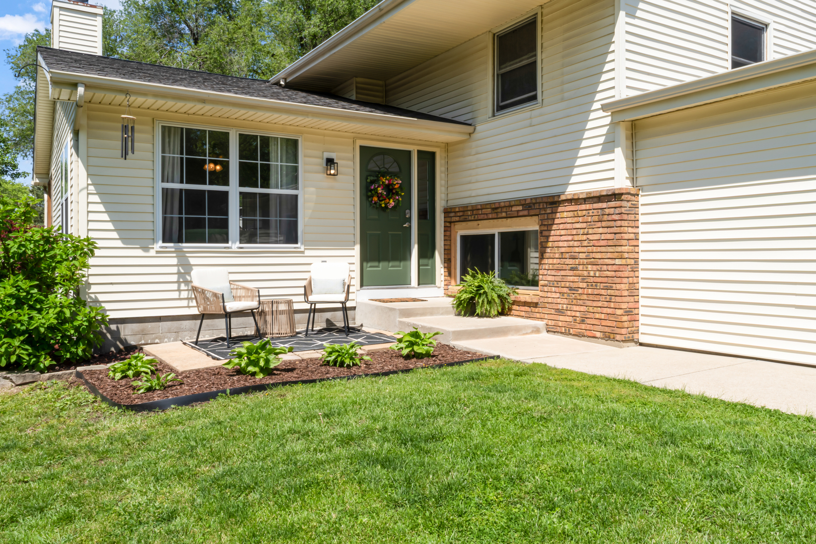 405 South Grove Street Normal, IL 61761 - Photo 1 of 40 a front view of a house with a garden and plants