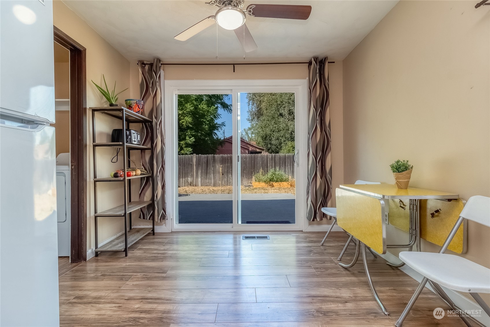 326 Harrison Street Walla Walla, WA 99362 - Photo 13 of 28 a view of an empty room with a window and wooden floor