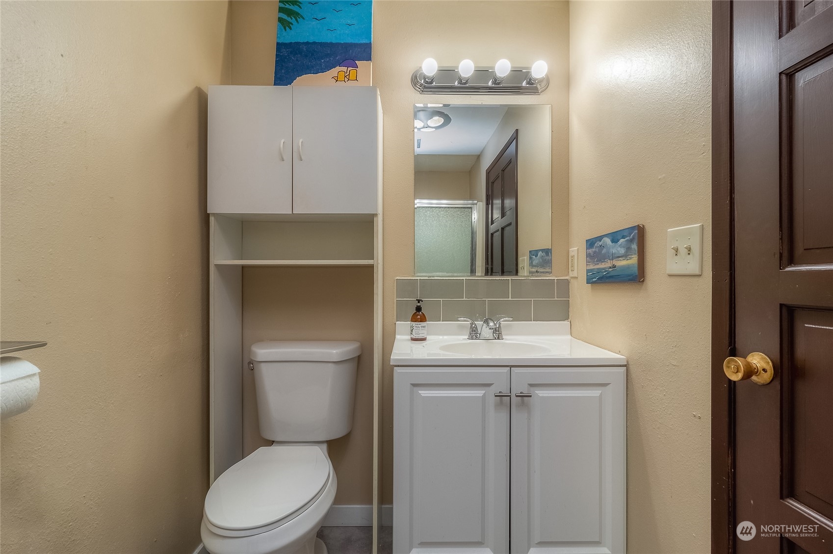 326 Harrison Street Walla Walla, WA 99362 - Photo 16 of 28 a bathroom with a toilet sink and mirror