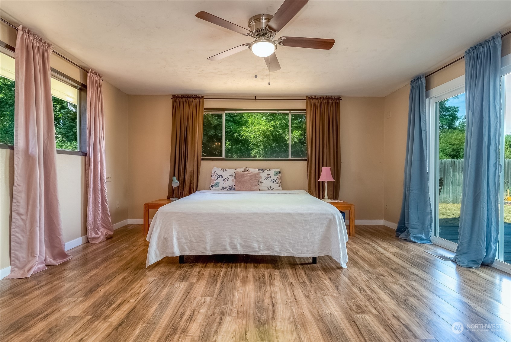 326 Harrison Street Walla Walla, WA 99362 - Photo 18 of 28 a bedroom with a bed and a large window with wooden floor