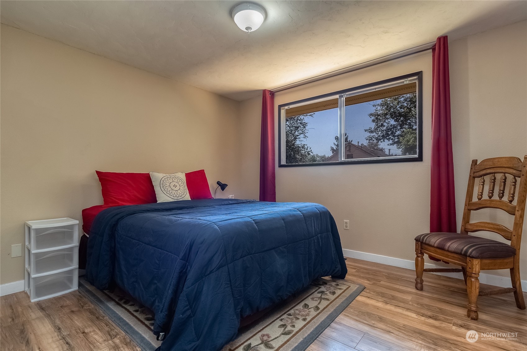 326 Harrison Street Walla Walla, WA 99362 - Photo 23 of 28 a bedroom with a bed and a chair