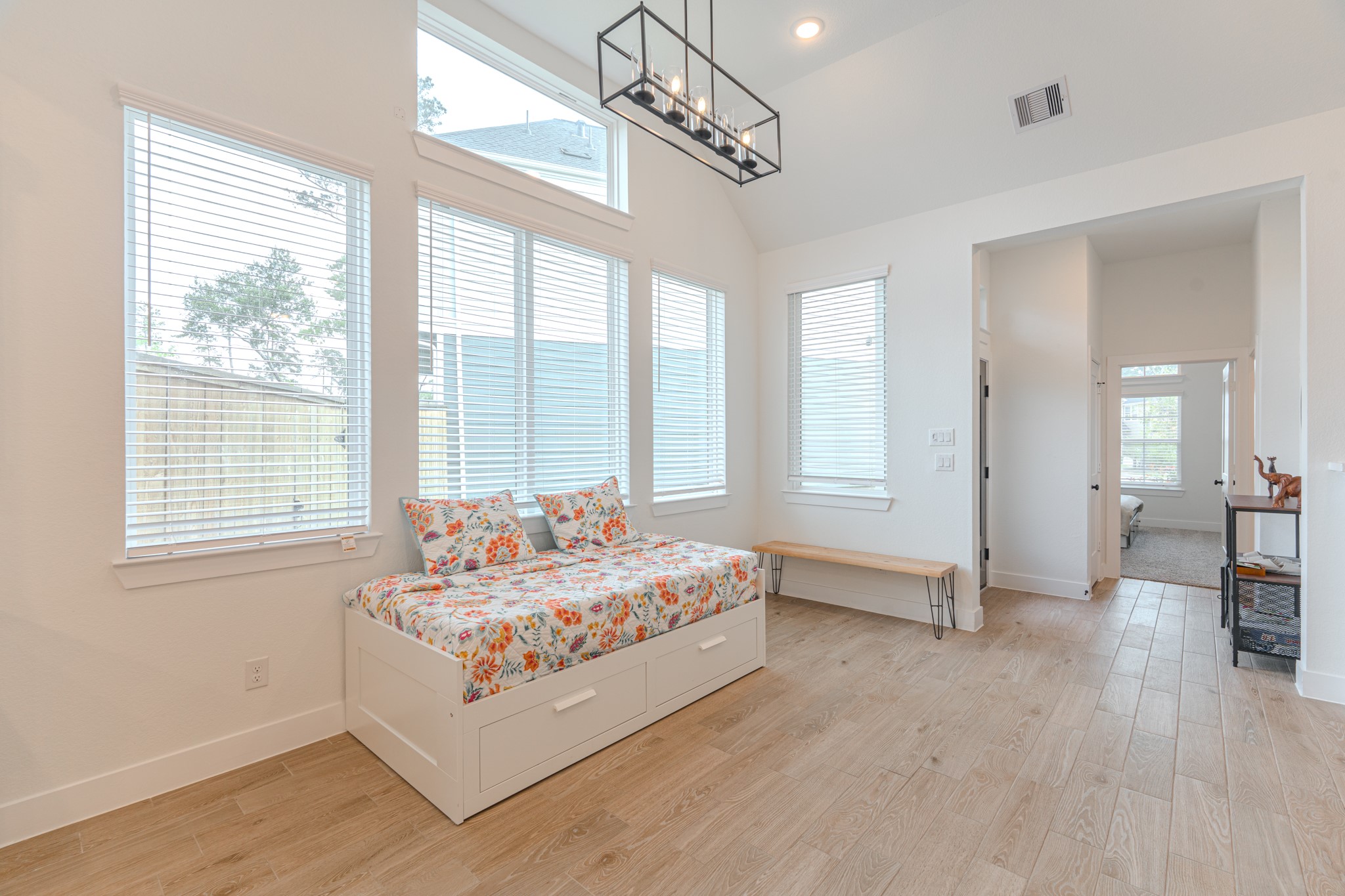 214 Prairie Rose Court Conroe, TX 77318 - Photo 11 of 30 a living room with furniture and windows