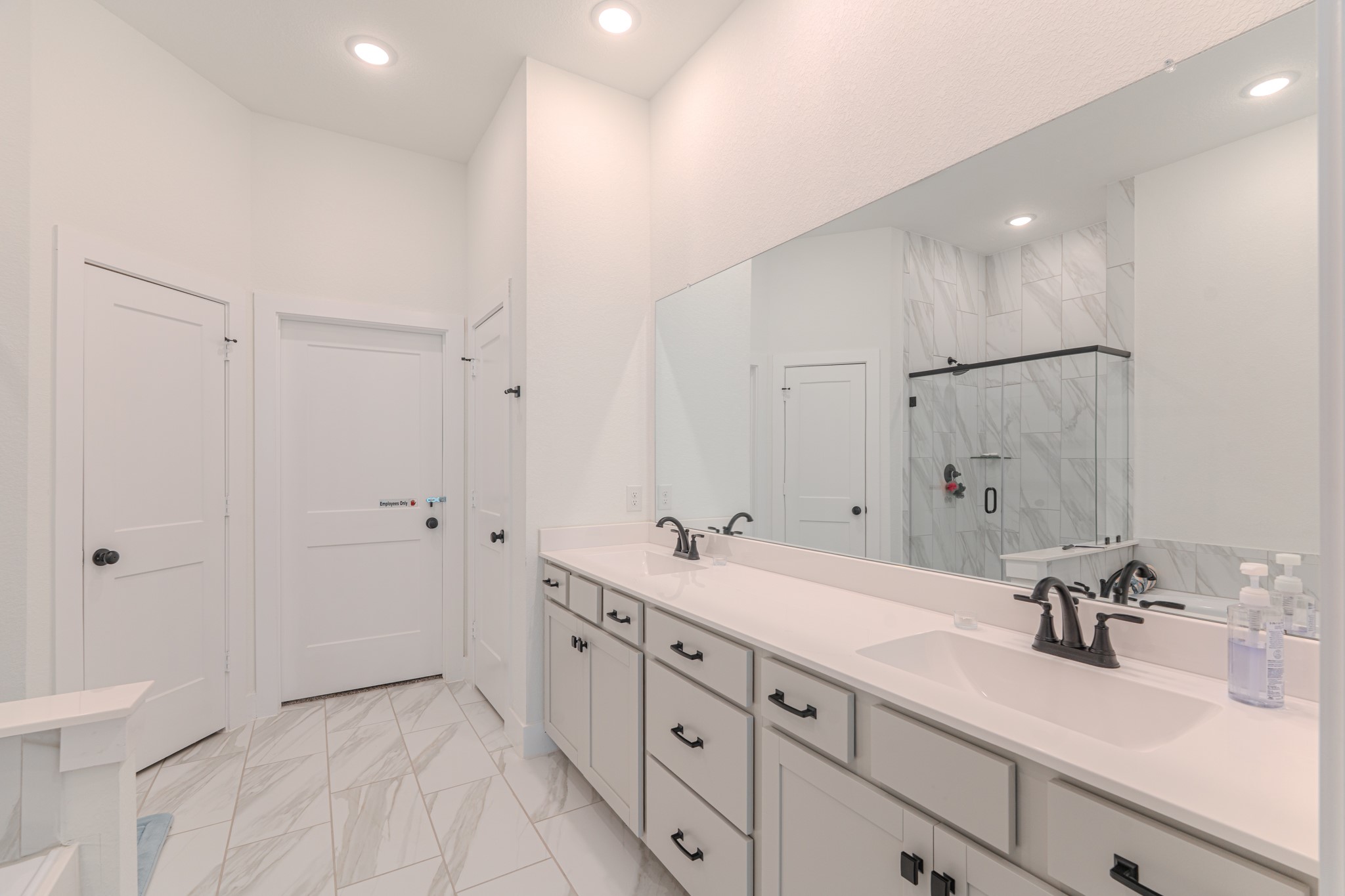 214 Prairie Rose Court Conroe, TX 77318 - Photo 18 of 30 a bathroom with a double vanity sink mirror and shower