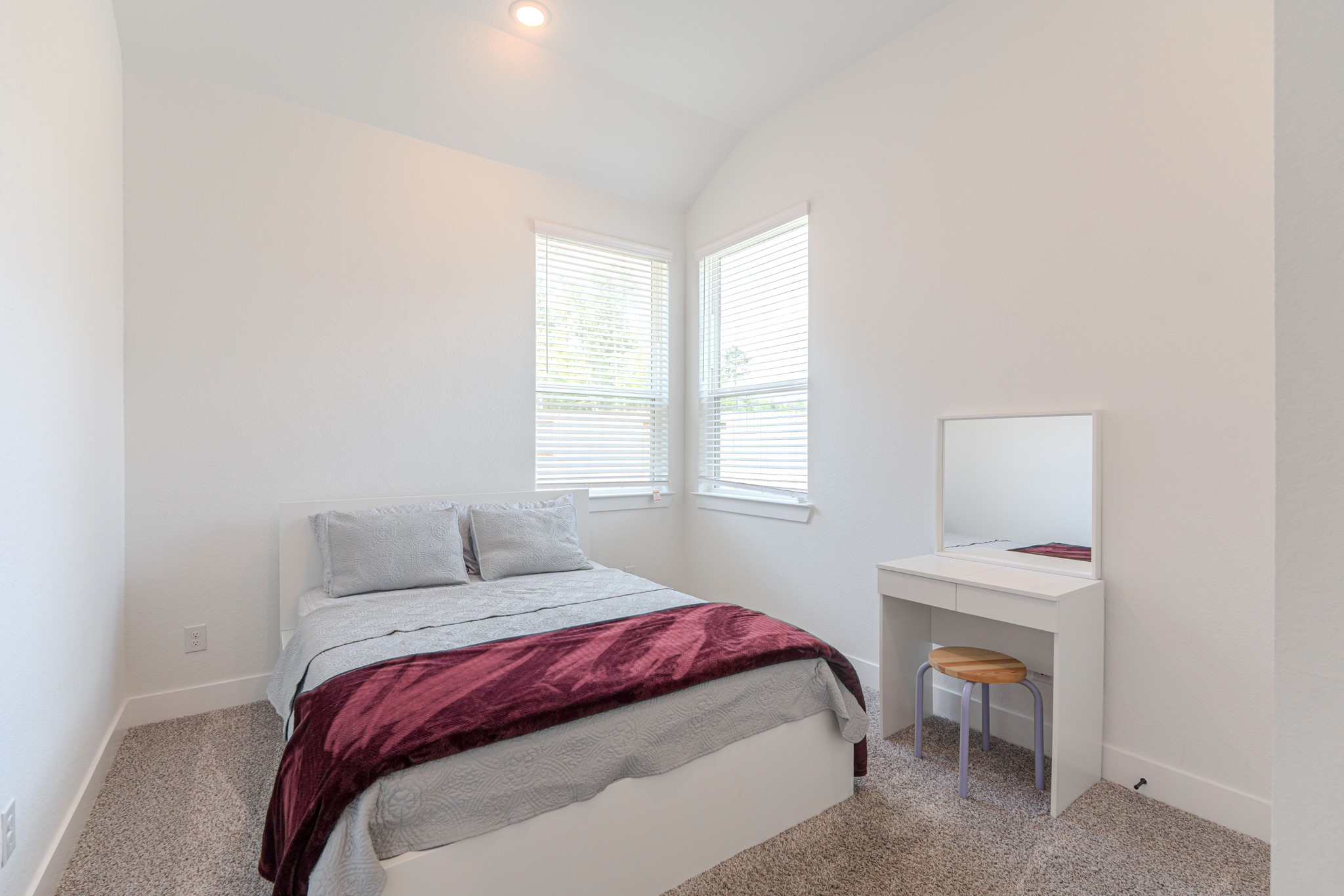 214 Prairie Rose Court Conroe, TX 77318 - Photo 20 of 30 a bedroom with a bed and a window