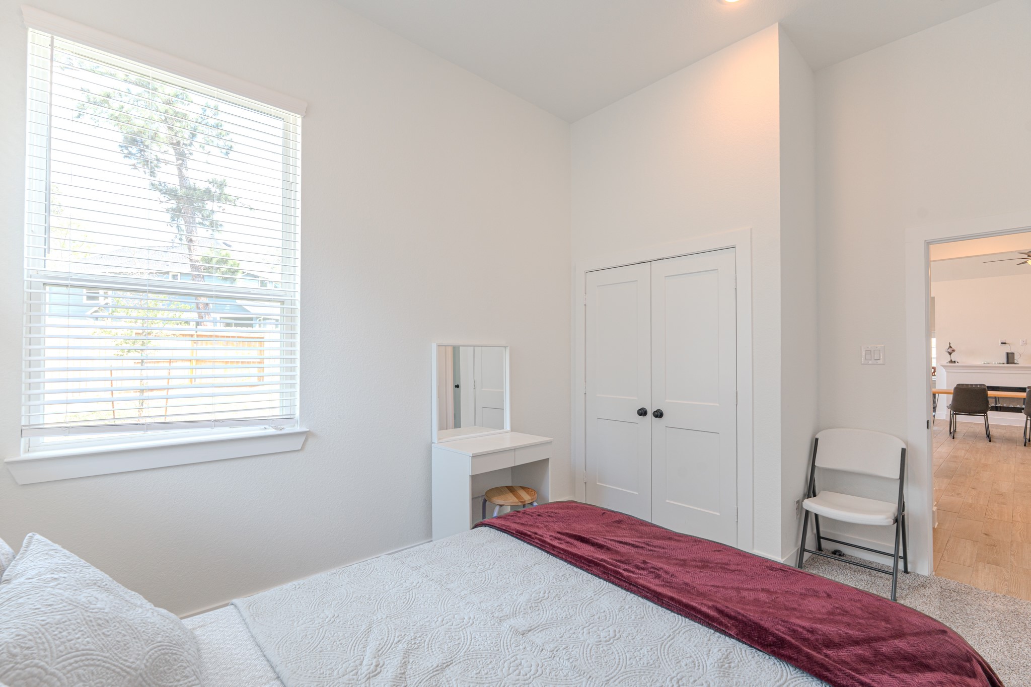 214 Prairie Rose Court Conroe, TX 77318 - Photo 21 of 30 a bedroom with a bed and a window