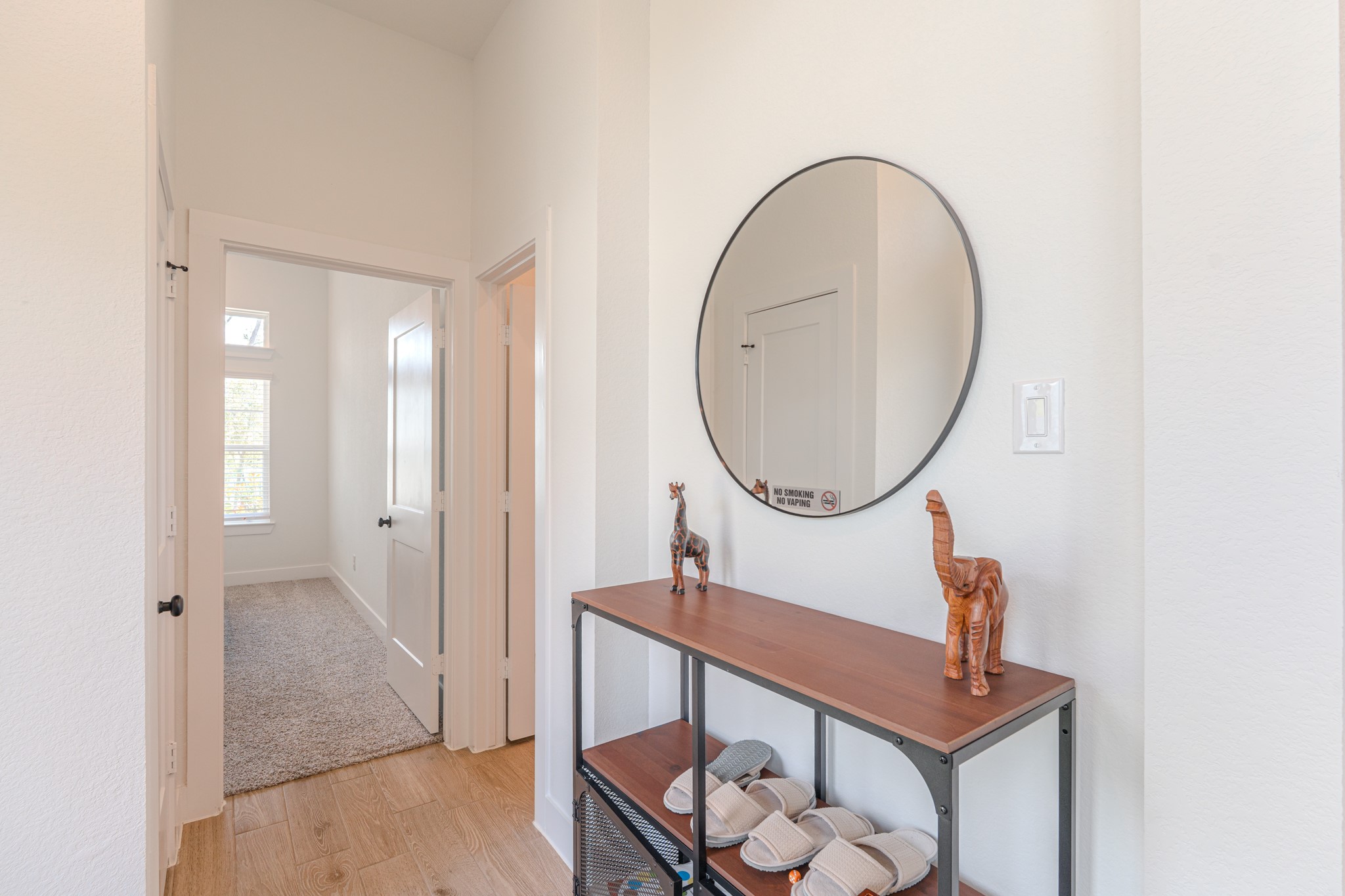 214 Prairie Rose Court Conroe, TX 77318 - Photo 22 of 30 a bathroom with a mirror a sink and a mirror