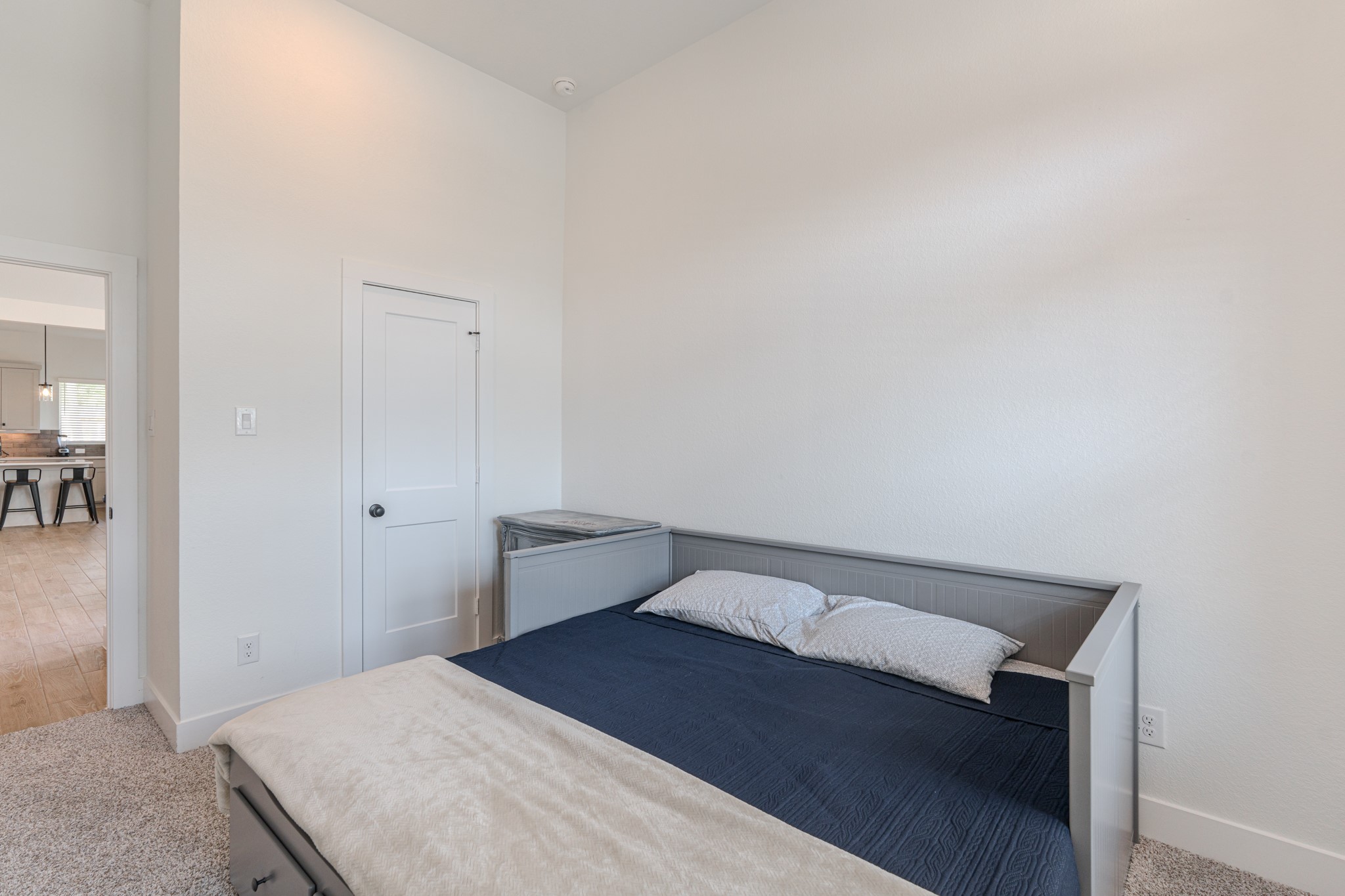 214 Prairie Rose Court Conroe, TX 77318 - Photo 24 of 30 a bedroom with a bed and cabinets