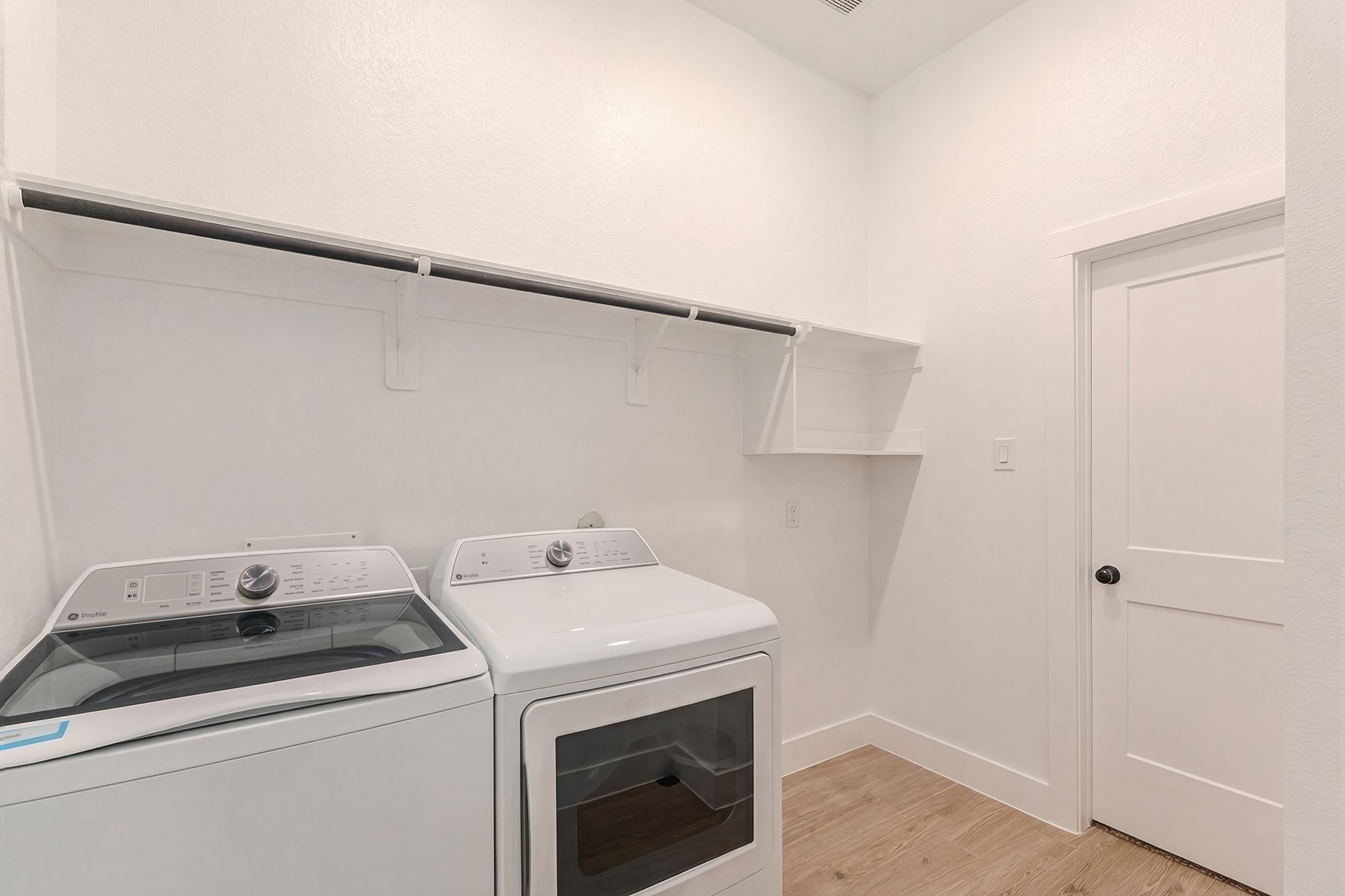214 Prairie Rose Court Conroe, TX 77318 - Photo 27 of 30 a utility room with dryer and washer