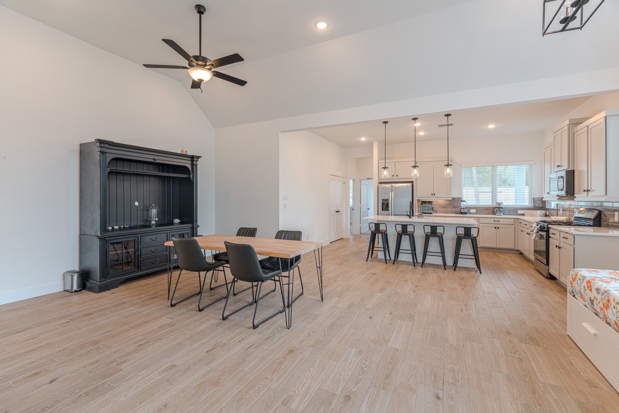 214 Prairie Rose Court Conroe, TX 77318 - Photo 5 of 30 a living room with furniture and a flat screen tv