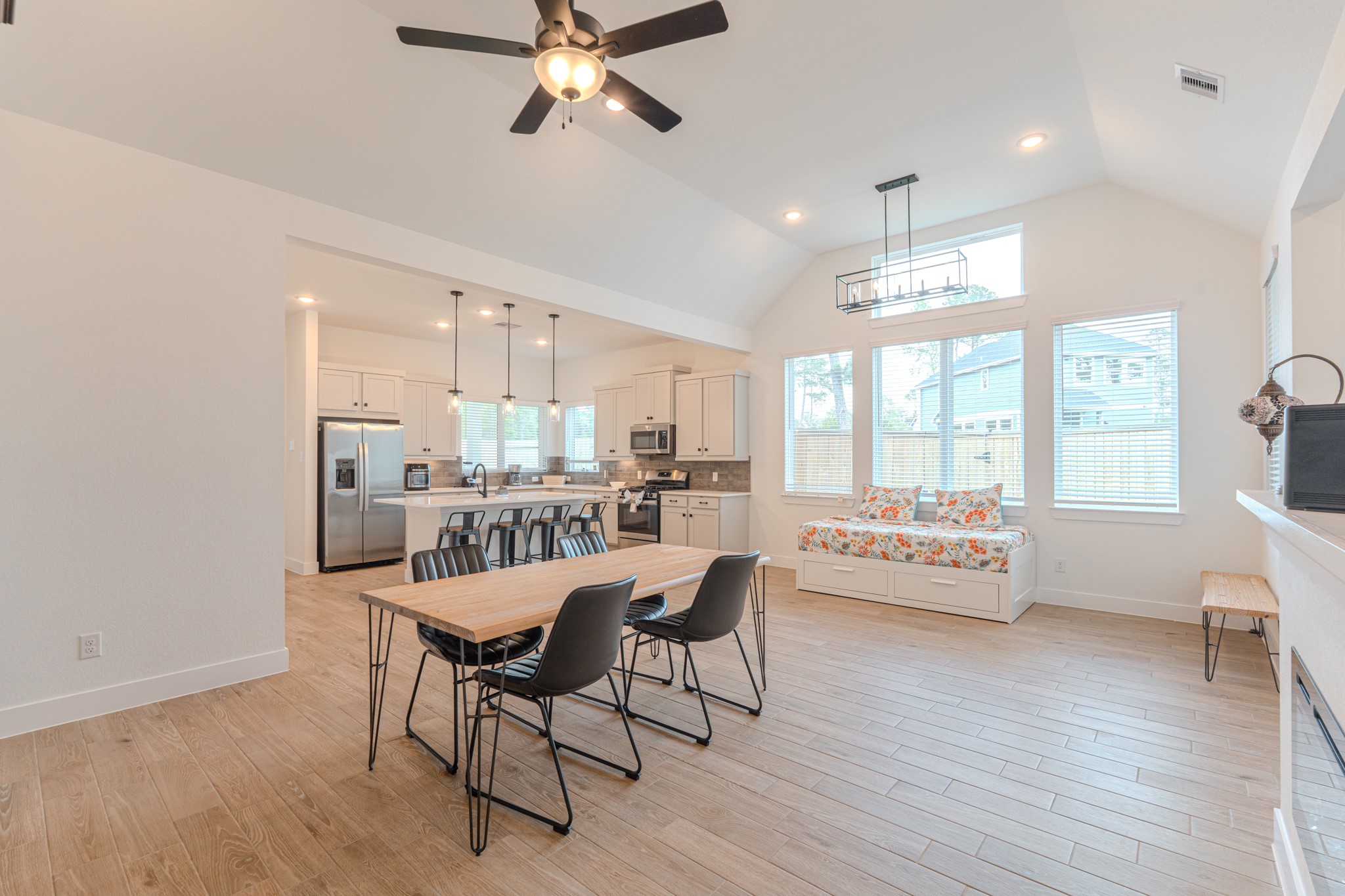 214 Prairie Rose Court Conroe, TX 77318 - Photo 7 of 30 a dining room with furniture and wooden floor