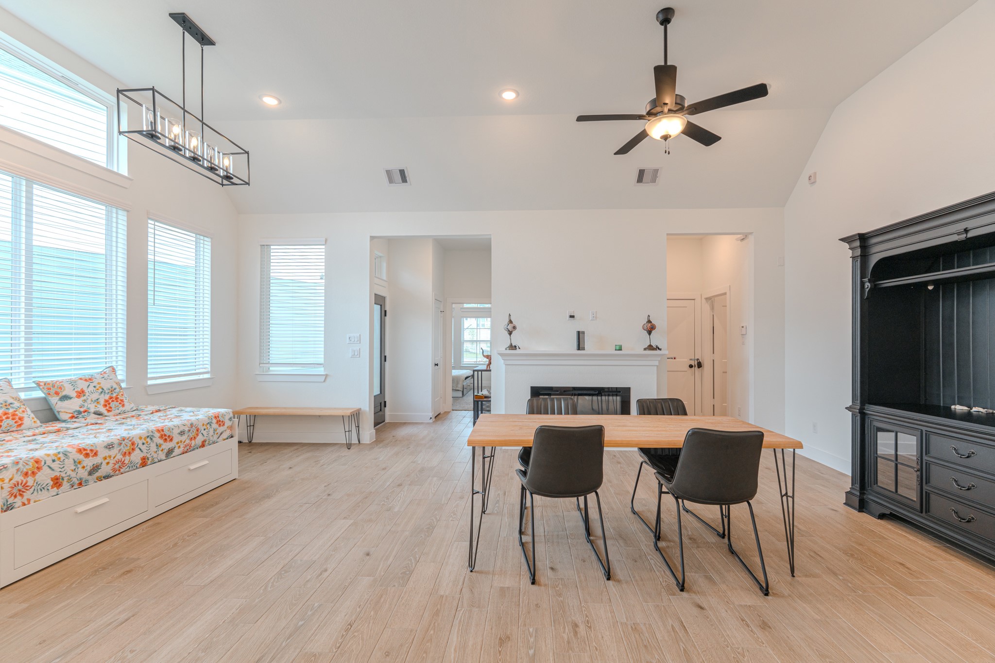 214 Prairie Rose Court Conroe, TX 77318 - Photo 9 of 30 a view of a dining room with furniture window and wooden floor