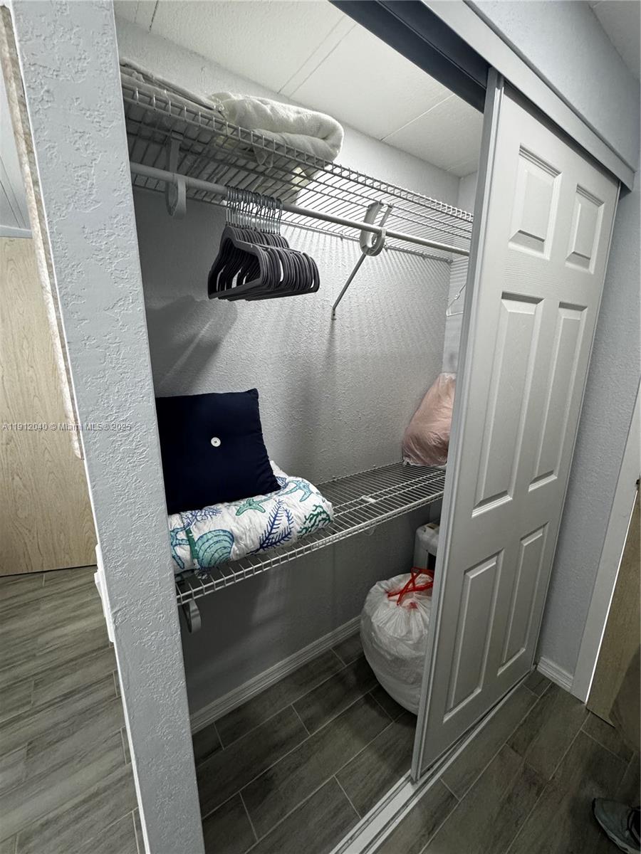 228 Orchid Street Tavernier, FL 33070 - Photo 23 of 43 a room with water heater and storage