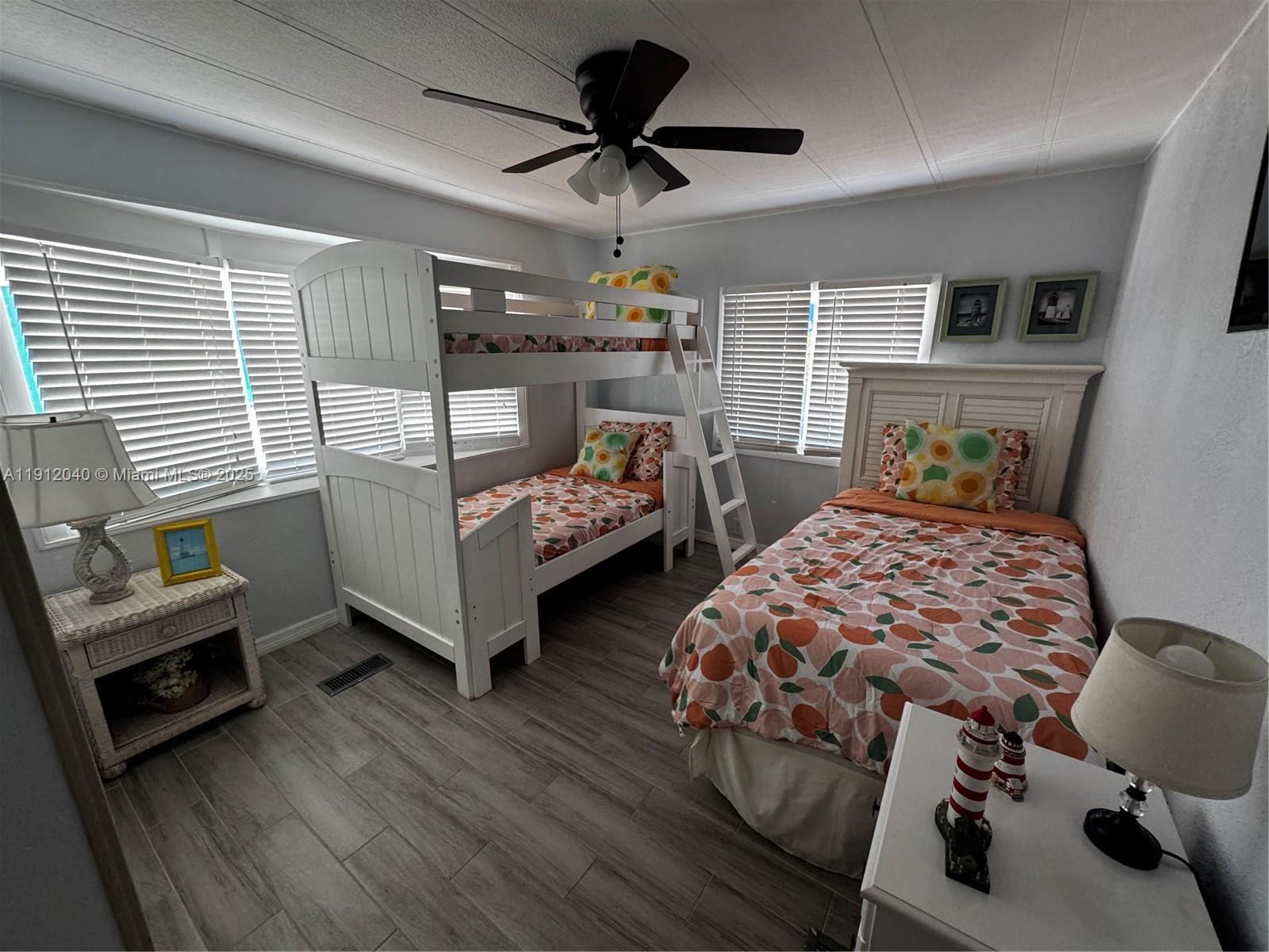 228 Orchid Street Tavernier, FL 33070 - Photo 24 of 43 a bedroom with bed and a window