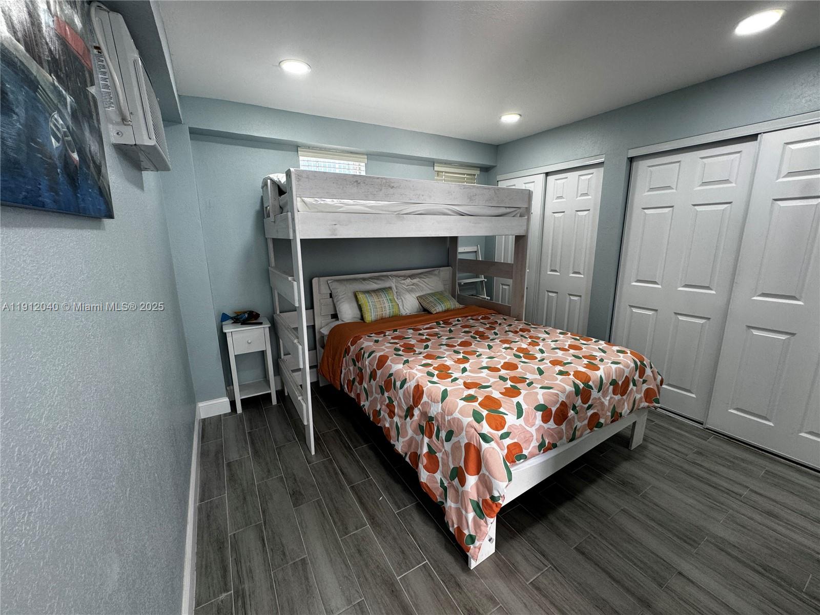 228 Orchid Street Tavernier, FL 33070 - Photo 28 of 43 a bed sitting in a bedroom next to a bathroom