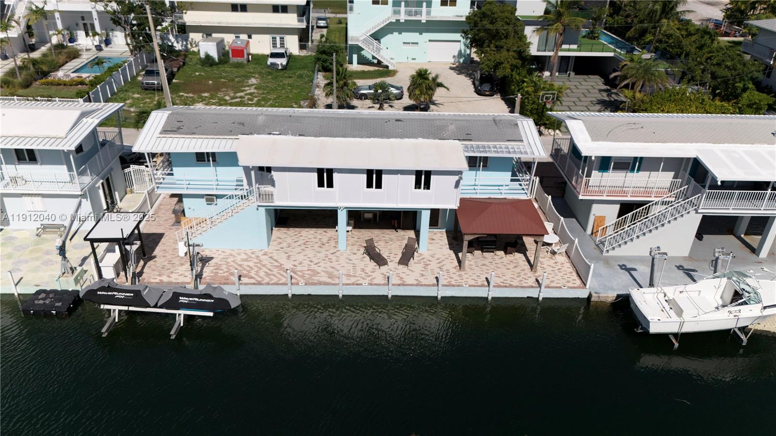 228 Orchid Street Tavernier, FL 33070 - Photo 3 of 43 a aerial view of a house with a yard