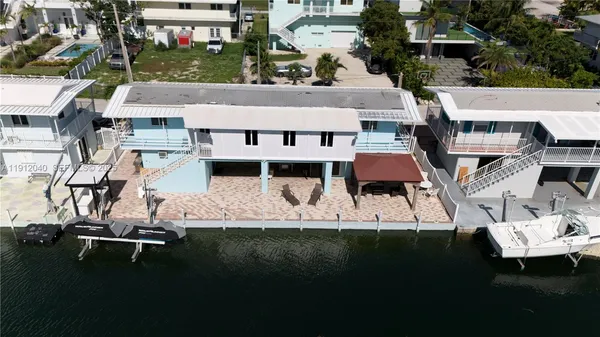 a aerial view of a house with a yard