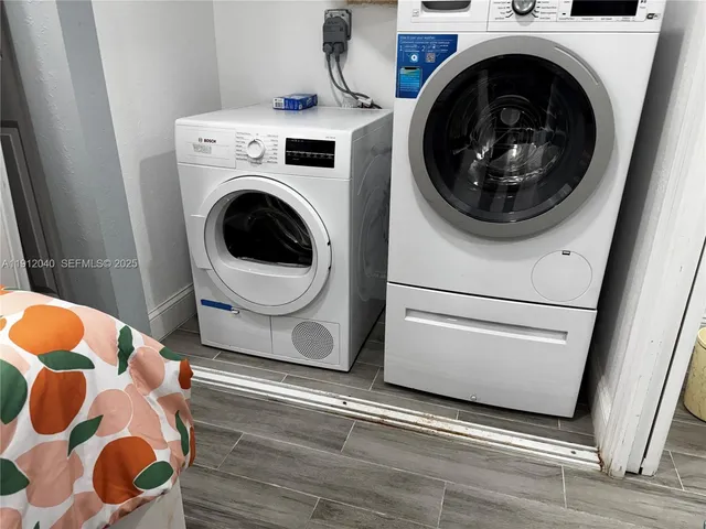 a utility room with dryer and washer