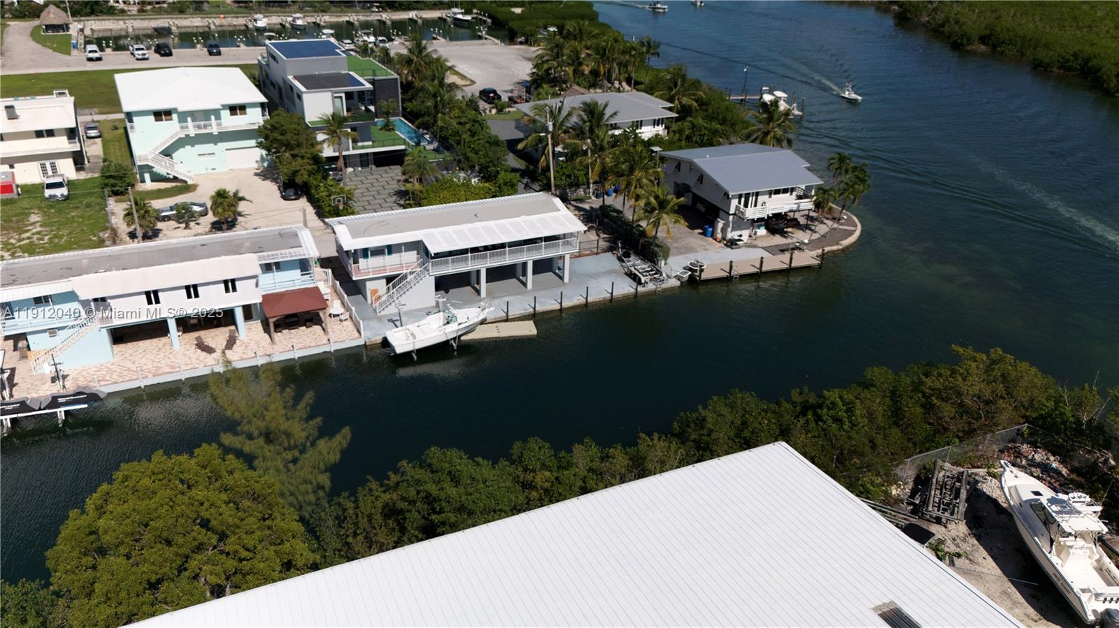 228 Orchid Street Tavernier, FL 33070 - Photo 5 of 43 an aerial view of a house with ocean view