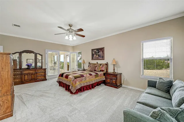 a living room with furniture large window and a couch