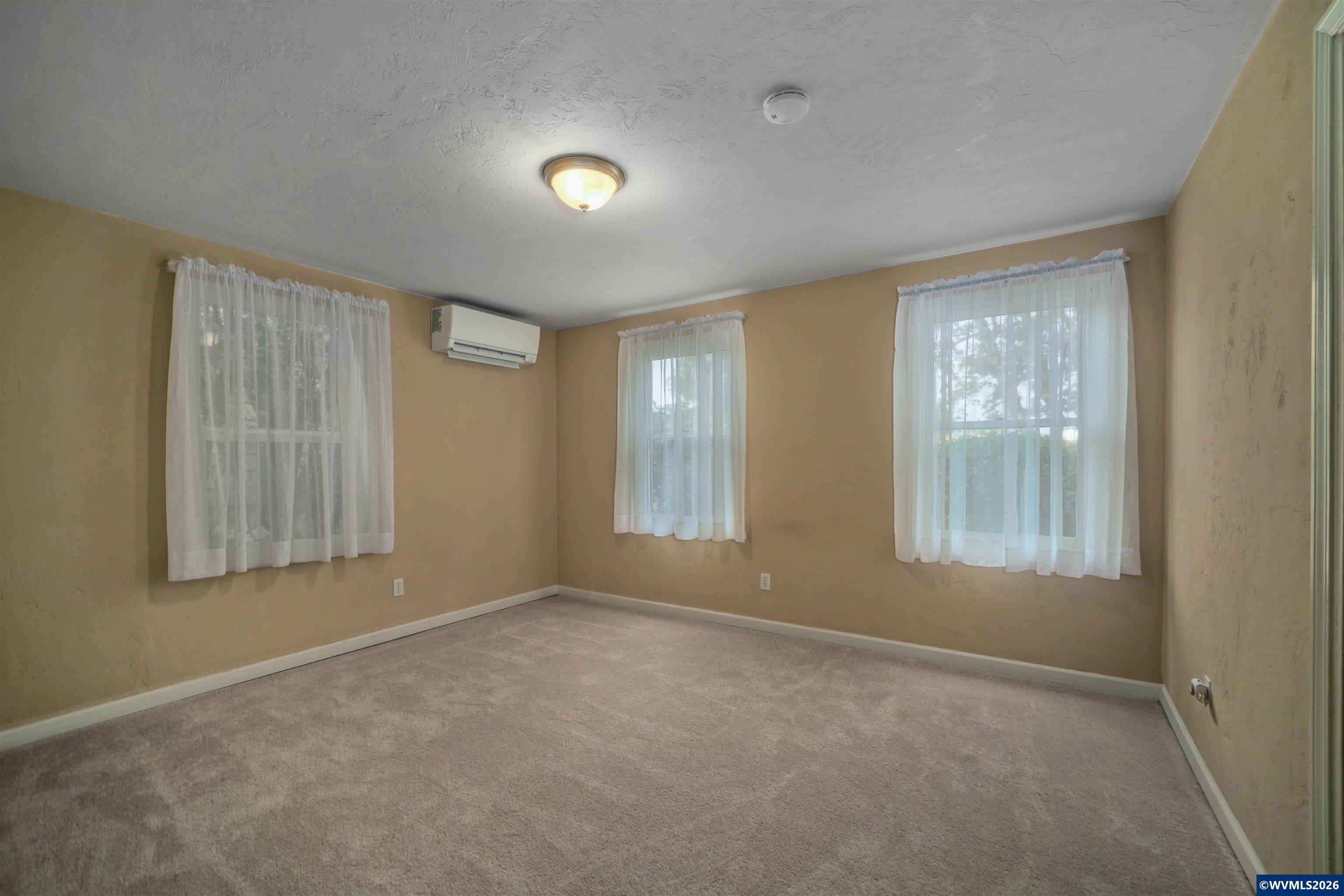 220 Northwest Downy Drive Sublimity, OR 97385 - Photo 22 of 47 a view of an empty room with a window