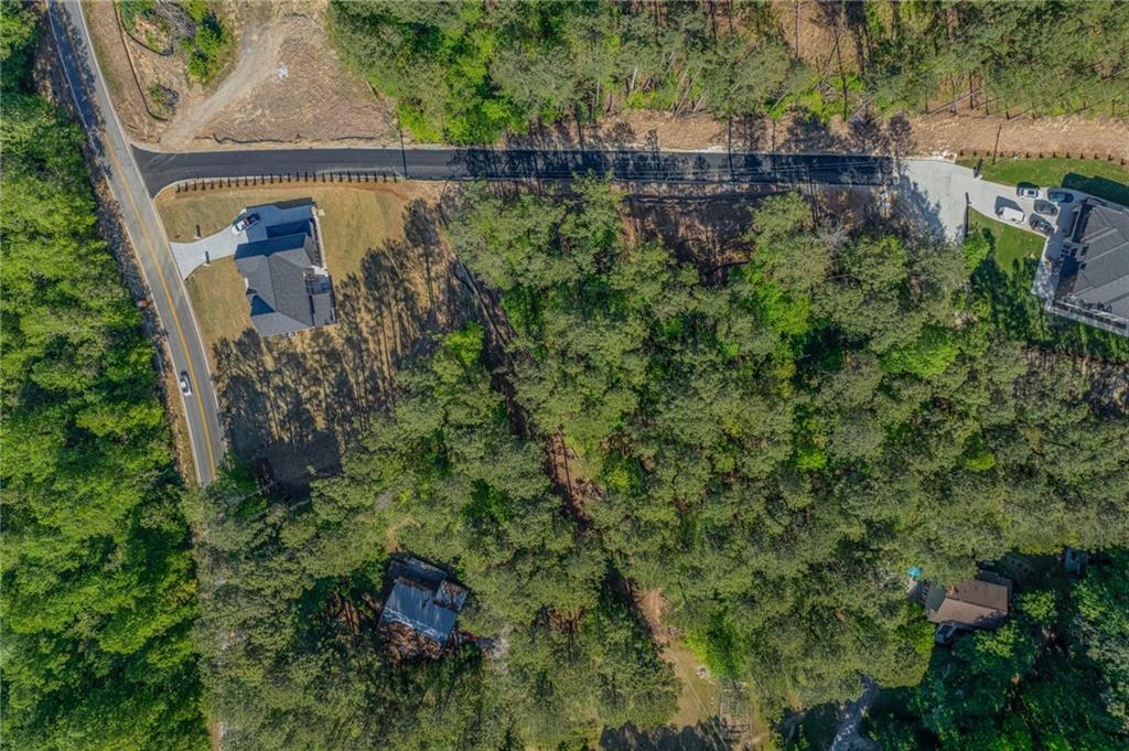 1559 Whitley Road Dacula, GA 30019 - Photo 13 of 34 an aerial view of residential house with outdoor space and trees all around