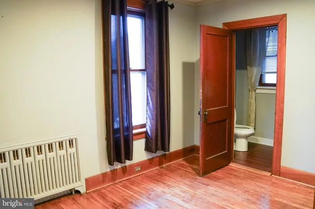 a view of a dining room with furniture and window