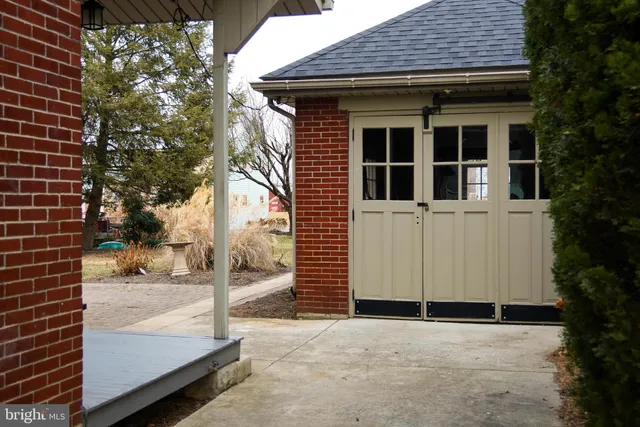 a view of a porch with wooden floor and a window