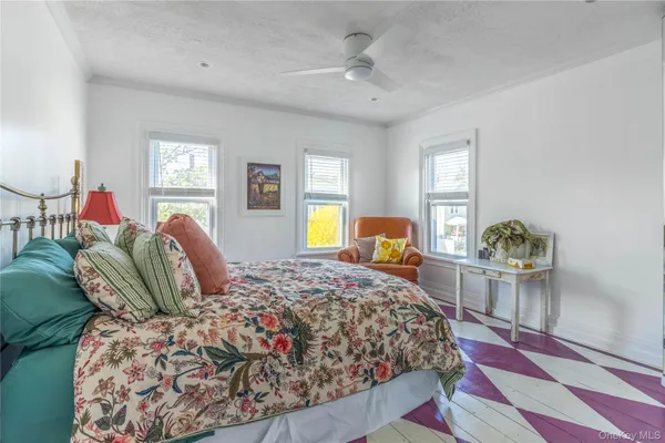 a bathroom with a bathtub a sink and a window