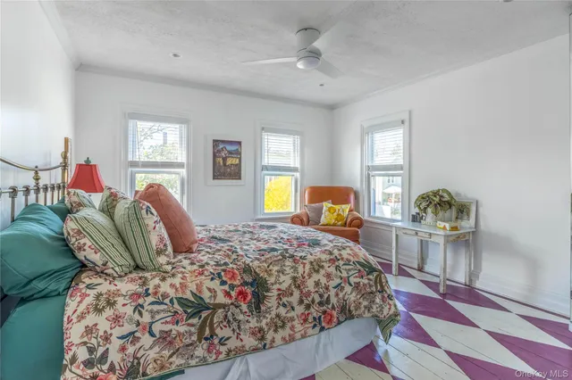 a bathroom with a bathtub a sink and a window