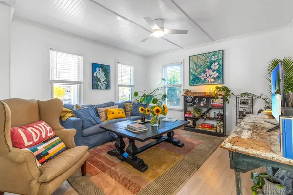 a view of a dining room with furniture kitchen and wooden floor