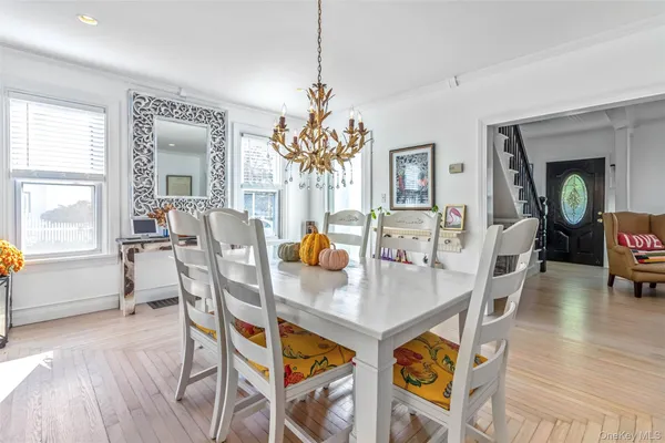 a view of kitchen with furniture wooden floor and window