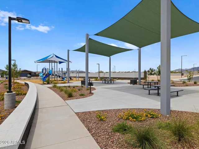 a view of a swimming pool with a lounge chairs