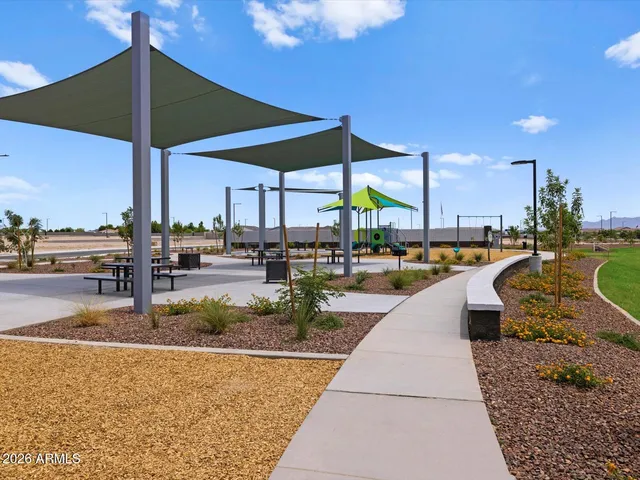 a view of a swimming pool with sitting area
