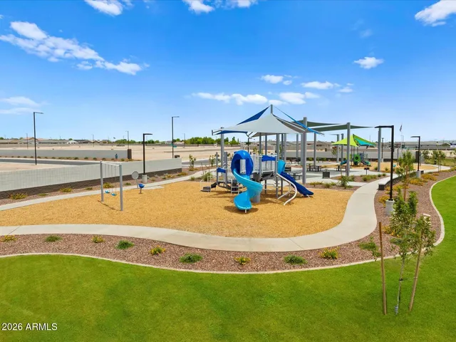 a view of a swimming pool with a table and chairs