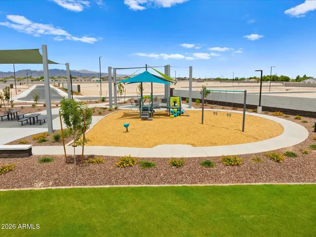 a view of a swimming pool with an outdoor seating
