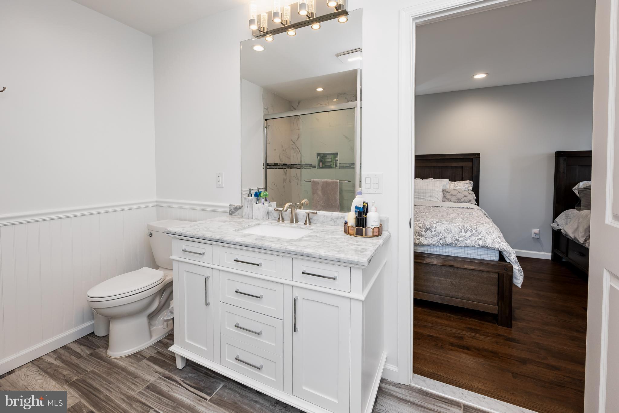 14470 Backbone Road Eden, MD 21822 - Photo 28 of 55 a spacious bathroom with a double vanity sink and a mirror