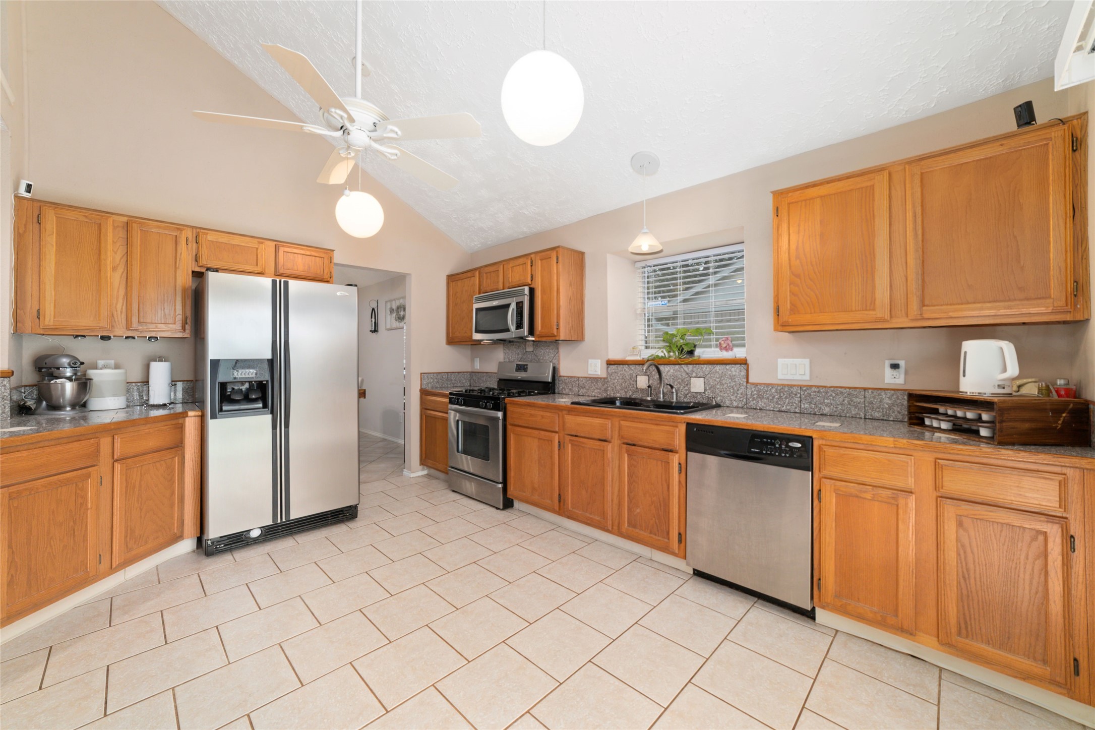 3315 Haydee Road Spring, TX 77388 - Photo 15 of 29 a kitchen with stainless steel appliances granite countertop a stove cabinets and refrigerator