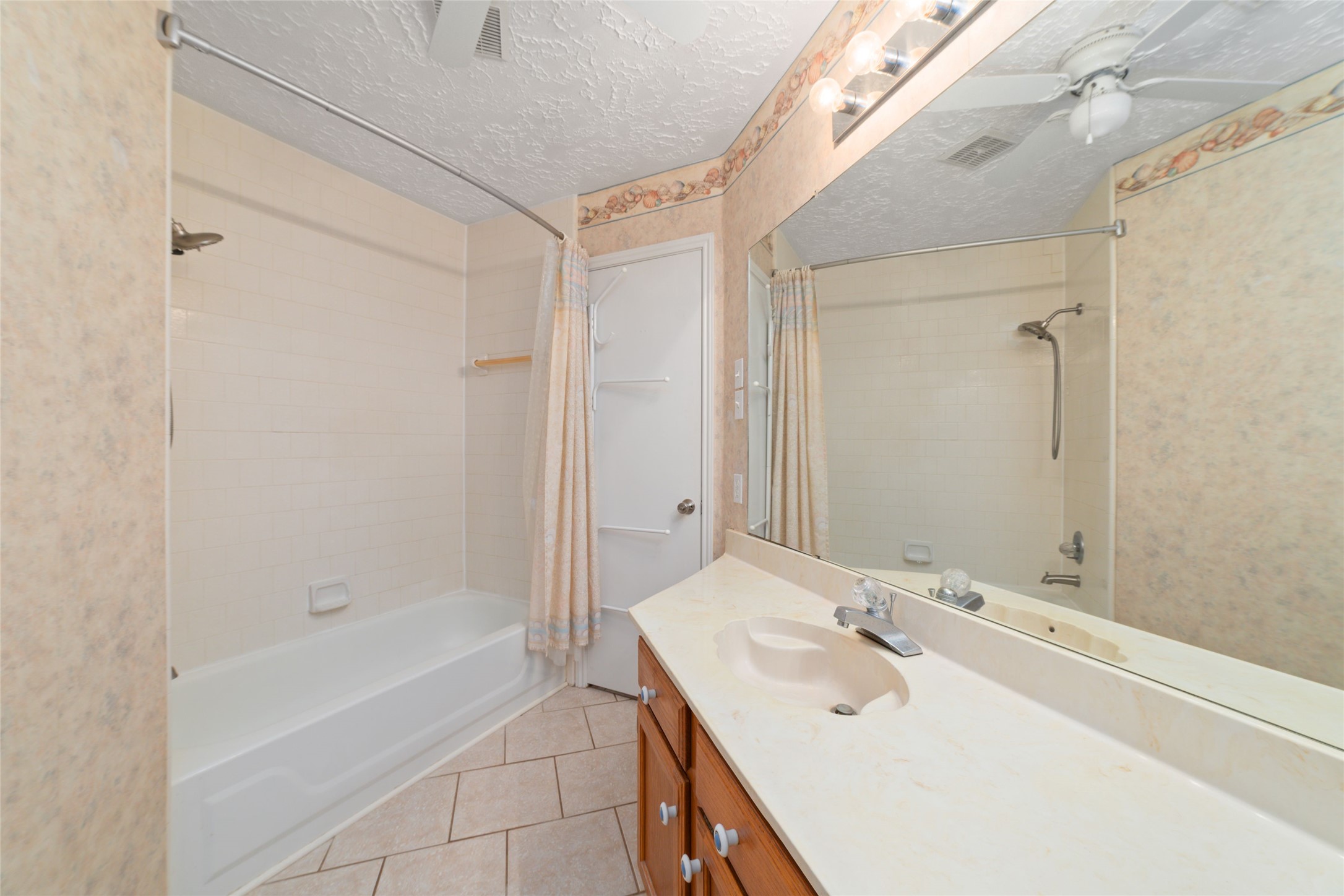 3315 Haydee Road Spring, TX 77388 - Photo 24 of 29 a bathroom with a tub a sink and mirror