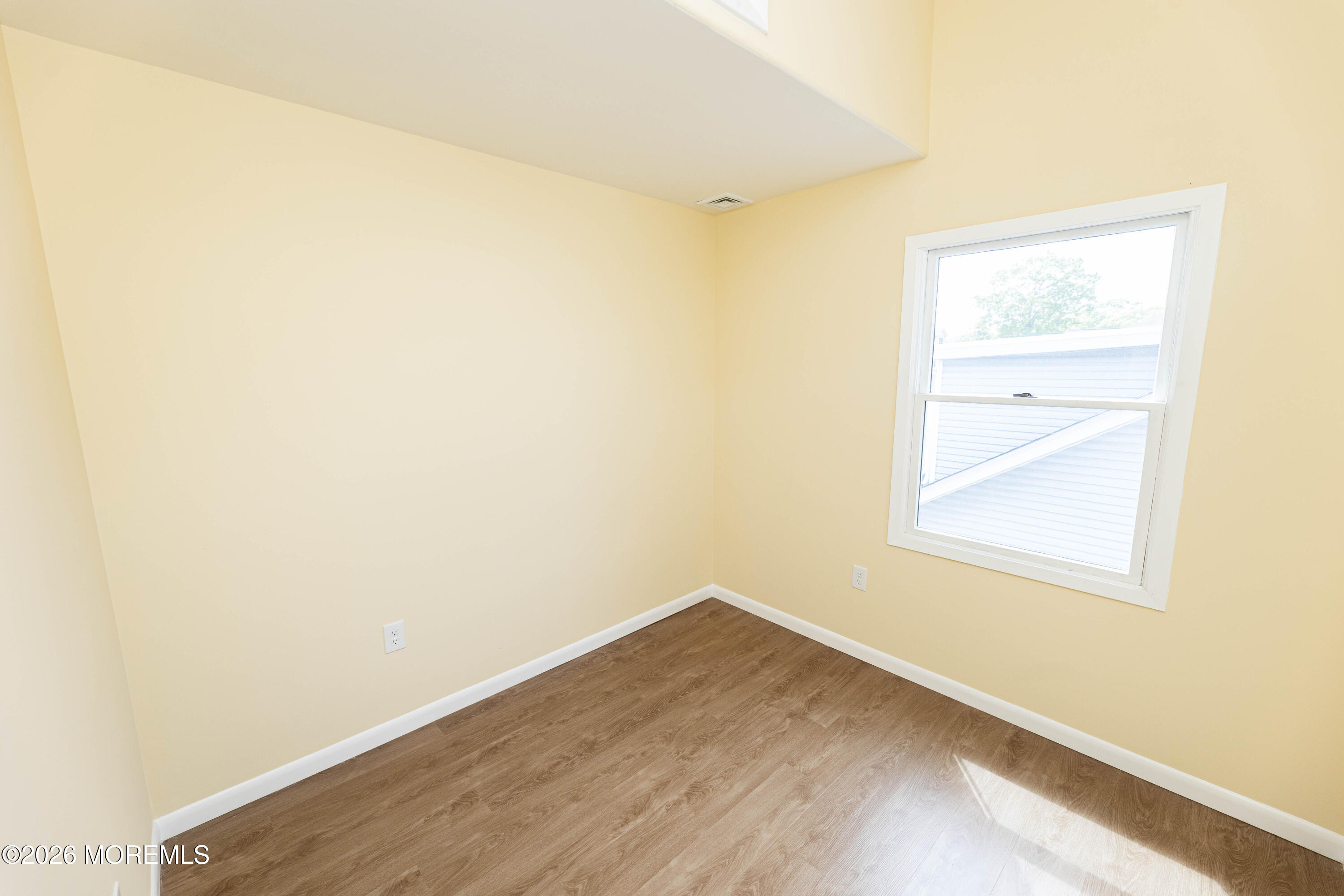 2408 Herbertsville Road Point Pleasant, NJ 08742 - Photo 58 of 82 a view of a small space with wooden floor and a window