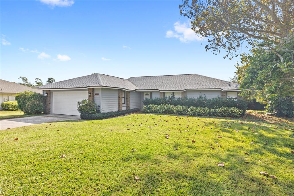 9508 Pine Terrace Court Windermere, FL 34786 - Photo 1 of 37 a front view of a house with a yard