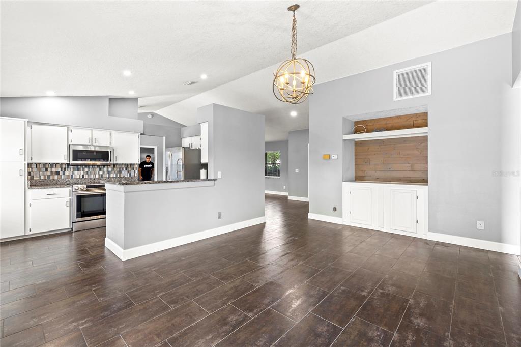 9508 Pine Terrace Court Windermere, FL 34786 - Photo 13 of 37 a view of a kitchen with a sink and dishwasher a refrigerator with wooden floor