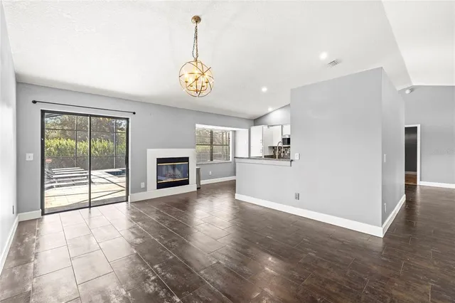 a view of a kitchen with a sink and a window