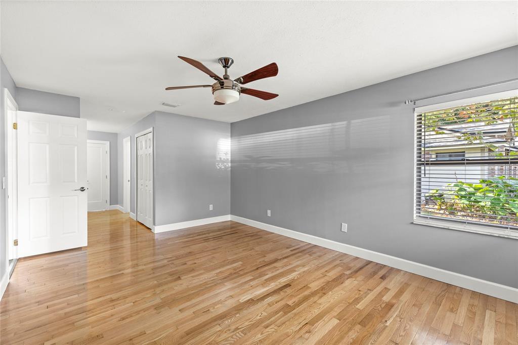 9508 Pine Terrace Court Windermere, FL 34786 - Photo 17 of 37 a view of an empty room with wooden floor and a window