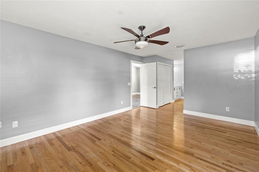 9508 Pine Terrace Court Windermere, FL 34786 - Photo 18 of 37 a view of an empty room and wooden floor