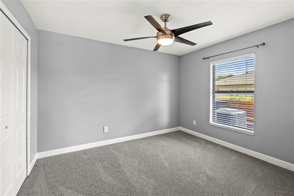 9508 Pine Terrace Court Windermere, FL 34786 - Photo 24 of 37 an empty room with a window and a fan