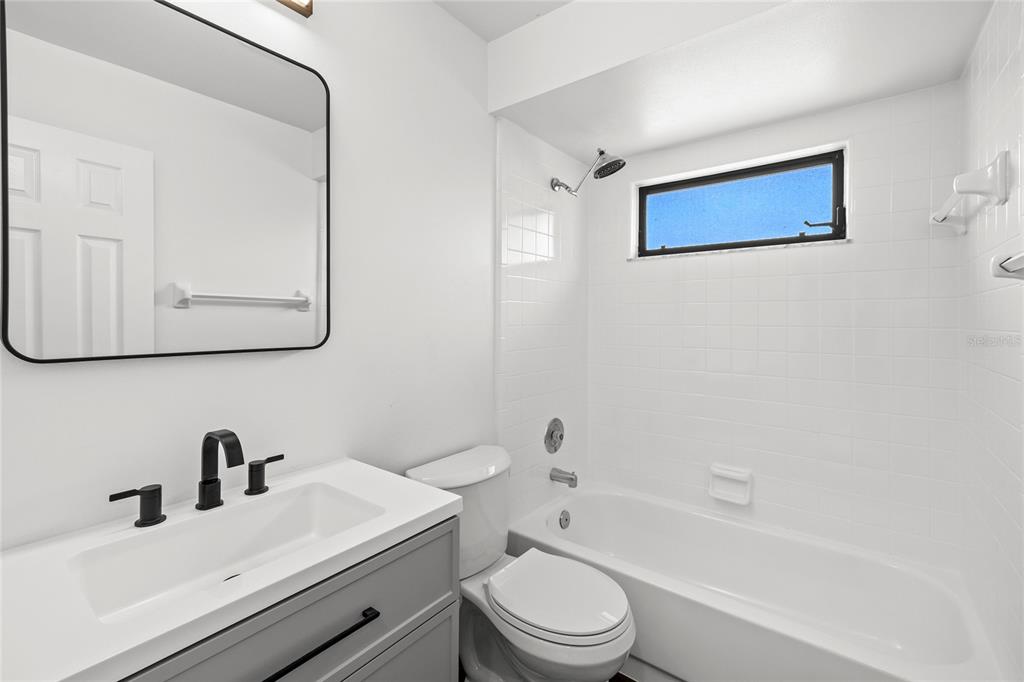 9508 Pine Terrace Court Windermere, FL 34786 - Photo 28 of 37 a bathroom with a sink a toilet and shower