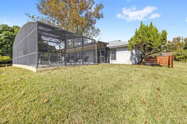 a view of kitchen with granite countertop window and stainless steel appliances