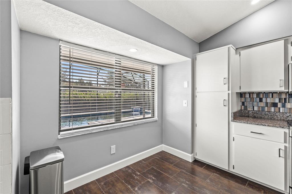 9508 Pine Terrace Court Windermere, FL 34786 - Photo 36 of 37 a view of kitchen with granite countertop window and stainless steel appliances