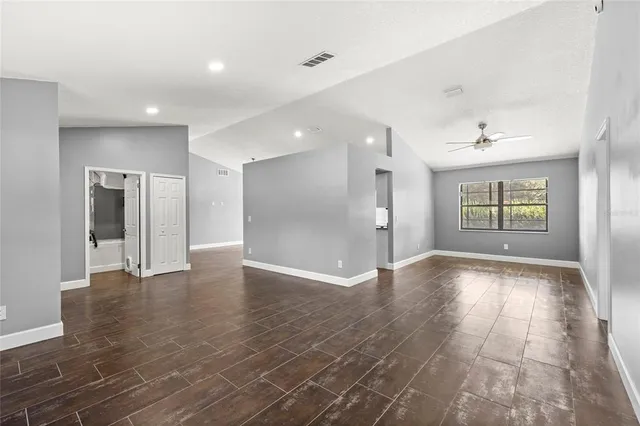 a view of an empty room and a window