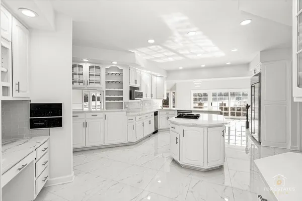 a kitchen with cabinets and white appliances
